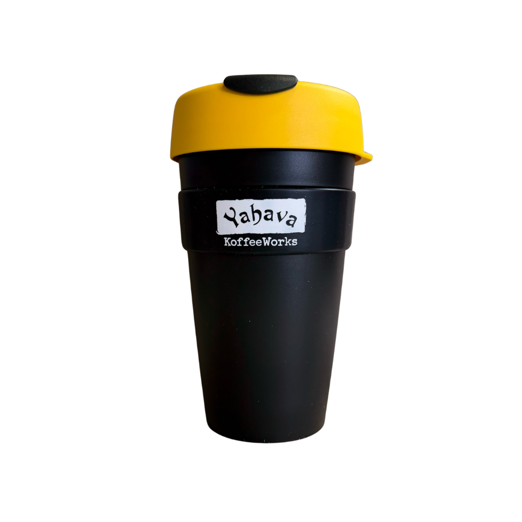 A reusable coffee cup with a black body, a bright yellow lid, and a black band around the middle featuring the 'Yahava KoffeeWorks' logo.