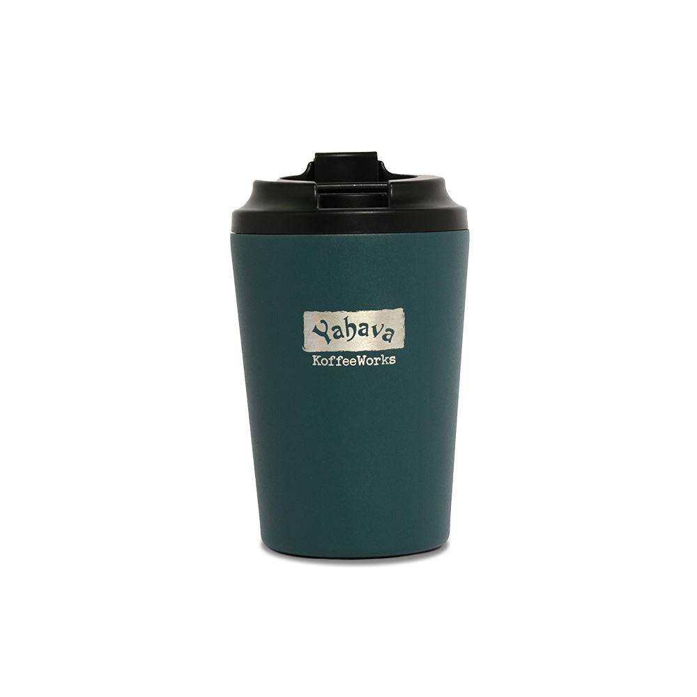 A emerald green travel mug with a black lid, branded with Yahava KoffeeWorks on the front.