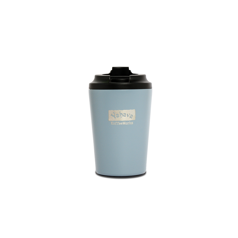 A blue travel mug with a black lid, branded with Yahava KoffeeWorks on the front.