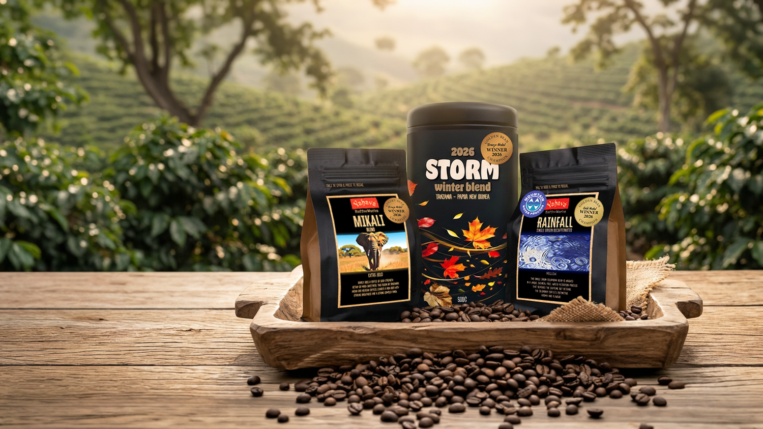 Yahava KoffeeWorks 2026 Golden Bean Award-winning coffee range featuring Storm Winter Blend, Mikali Blend and Rainfall Single Origin Decaffeinated in a coffee plantation setting.