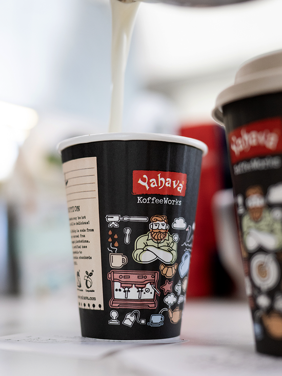 Hot Yahava KoffeeWorks takeaway cup covered in Western Australian icons