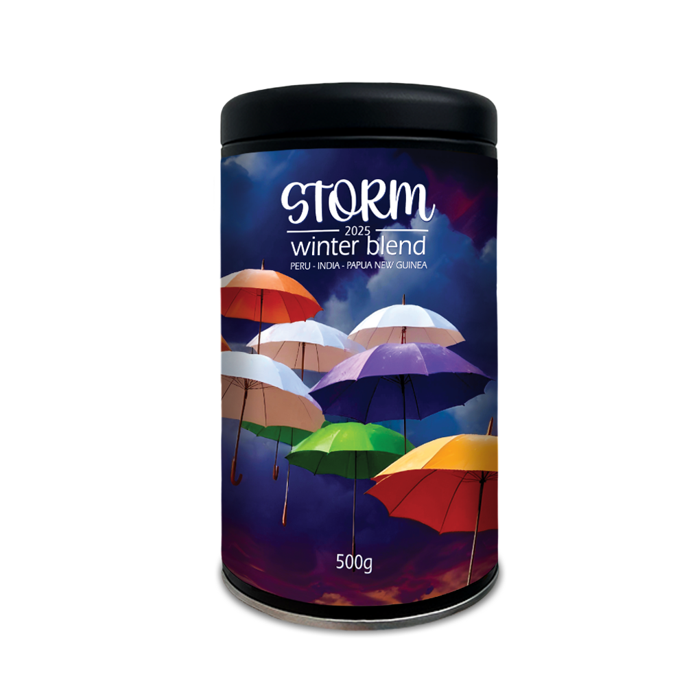 Coffee canister labelled 'Storm Winter Blend' with colourful umbrellas on a blue background